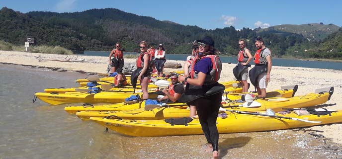 Sea kayaks on the golden sands of the Abel Tasman